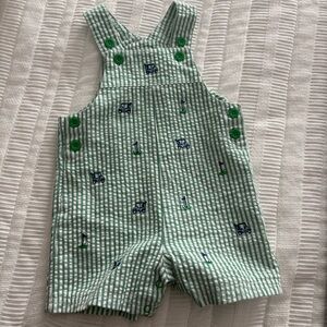 Green and white seersucker embroidered golf romper